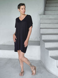 caraucci-woman-wearing-black-v-neck-tunic-as-a-dress #color_black