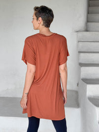 caraucci-woman-wearing-copper-v-neck-tunic-and-black-leggings #color_copper