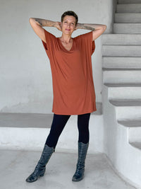 caraucci-woman-wearing-copper-v-neck-tunic-and-black-leggings #color_copper