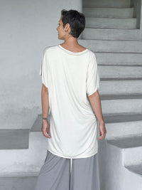 caraucci-woman-wearing-cream-v-neck-tunic-and-light-grey-wide-leg-pants #color_cream