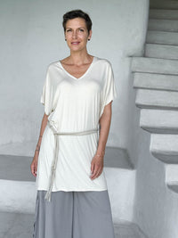 caraucci-woman-wearing-cream-v-neck-tunic-and-a-belt-and-light-grey-wide-leg-pants #color_cream