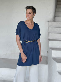 caraucci-woman-wearing-navy-v-neck-tunic-and-cream-wide-leg-pants-and-belt #color_navy