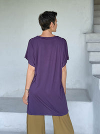 caraucci-woman-wearing-purple-v-neck-tunic-and-brass-wide-leg-pants #color_plum