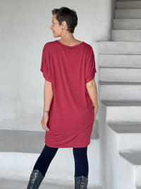 caraucci-woman-wearing-red-v-neck-tunic-and-black-leggings #color_scarlet