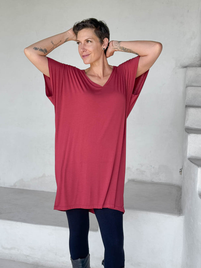 caraucci-woman-wearing-red-v-neck-tunic-and-black-leggings #color_scarlet