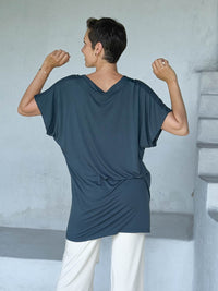 caraucci-woman-wearing-teal-v-neck-tunic-and-cream-wide-leg-pants #color_teal