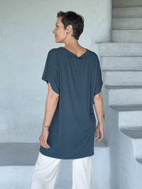 caraucci-woman-wearing-teal-v-neck-tunic-and-cream-wide-leg-pants #color_teal