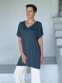caraucci-woman-wearing-teal-v-neck-tunic-and-cream-wide-leg-pants #color_teal