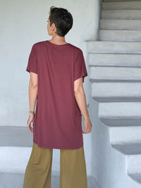 caraucci-woman-wearing-maroon-v-neck-tunic-and-brass-wide-leg-pants #color_wine