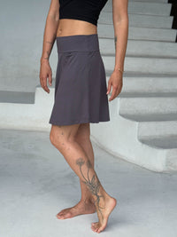 caraucci navy skort with relaxed fit and subtle flare #color_steel