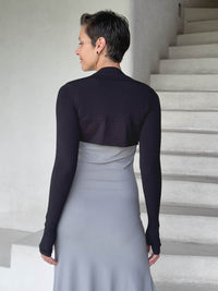 caraucci-woman-wearing-black-sleeve-shrug-layered-over-grey-dress-with-thumbhole-detail #color_black