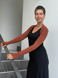women's plant based rayon jersey stretchy orange sleeve shrug with thumbholes #color_copper