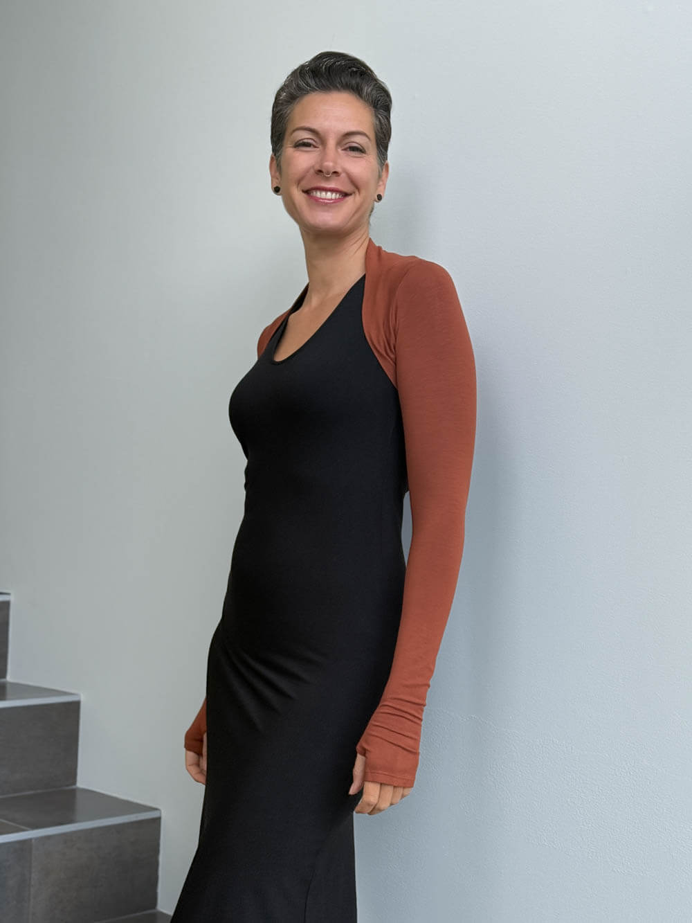 women's plant based rayon jersey stretchy orange sleeve shrug with thumbholes #color_copper