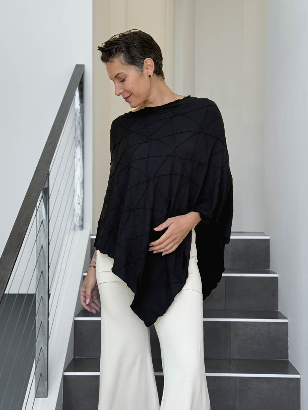 caraucci women's plant based rayon jersey black textured poncho can be worn multiple ways; dress, skirt, halter top #color_black