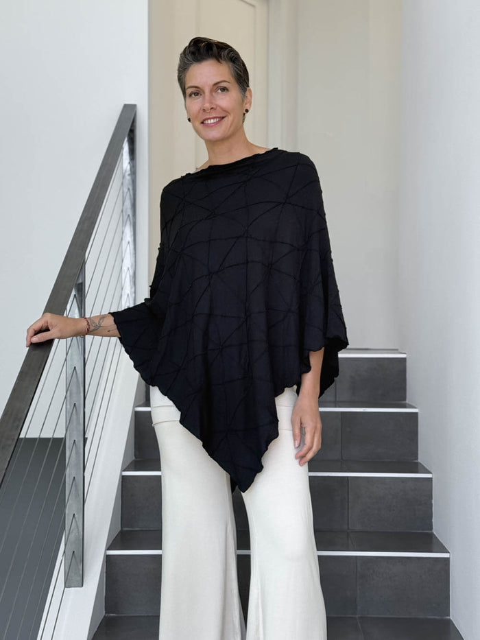 caraucci women's plant based rayon jersey black textured poncho can be worn multiple ways; dress, skirt, halter top #color_black