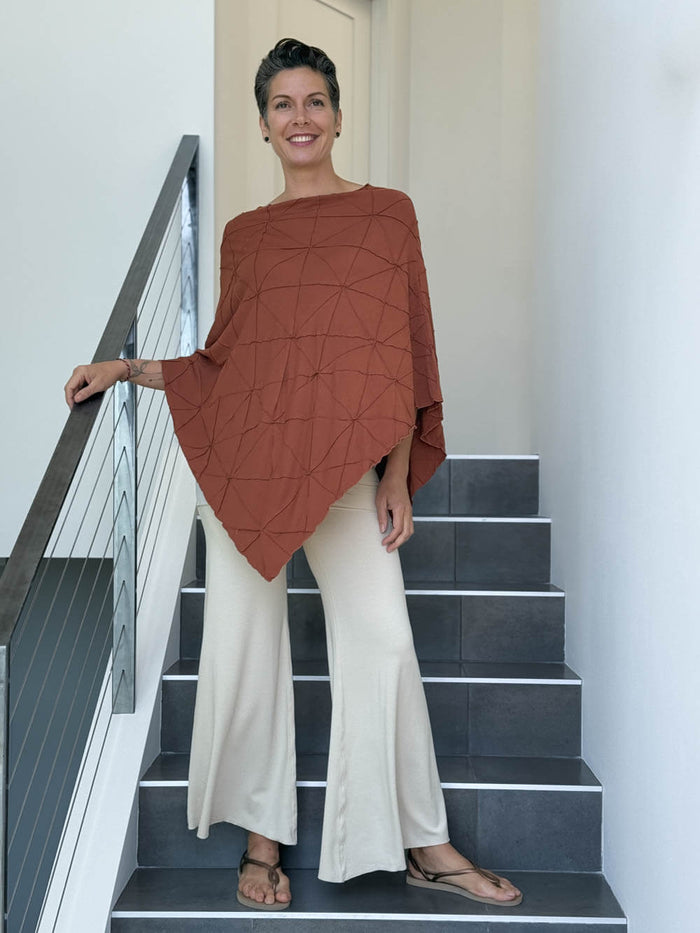 caraucci women's plant based rayon jersey orange textured poncho can be worn multiple ways; dress, skirt, halter top #color_copper