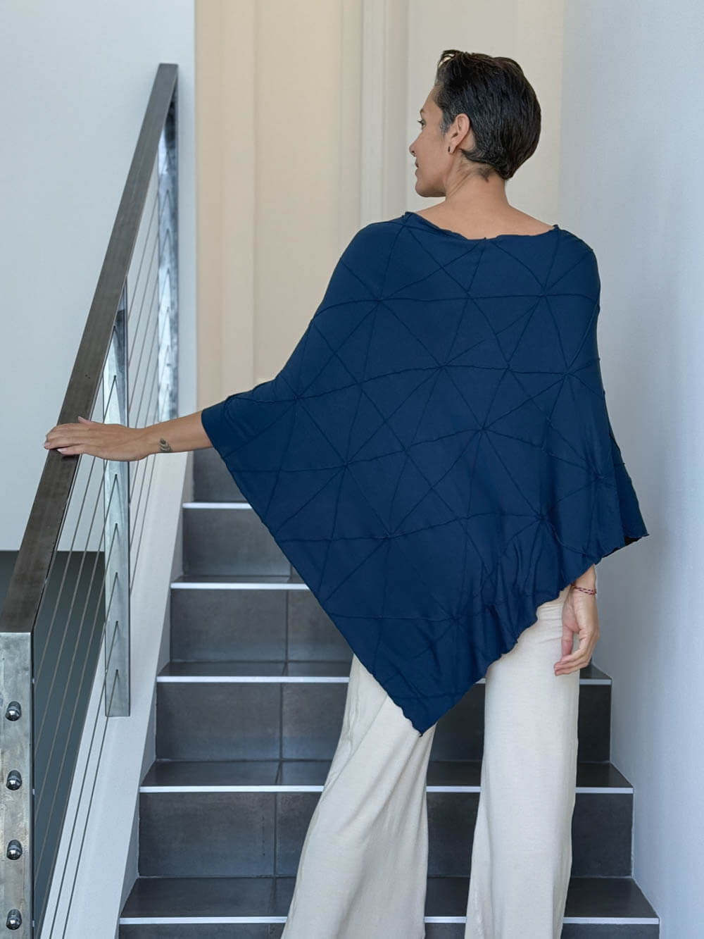 caraucci women's plant based rayon jersey navy blue textured poncho can be worn multiple ways; dress, skirt, halter top #color_navy