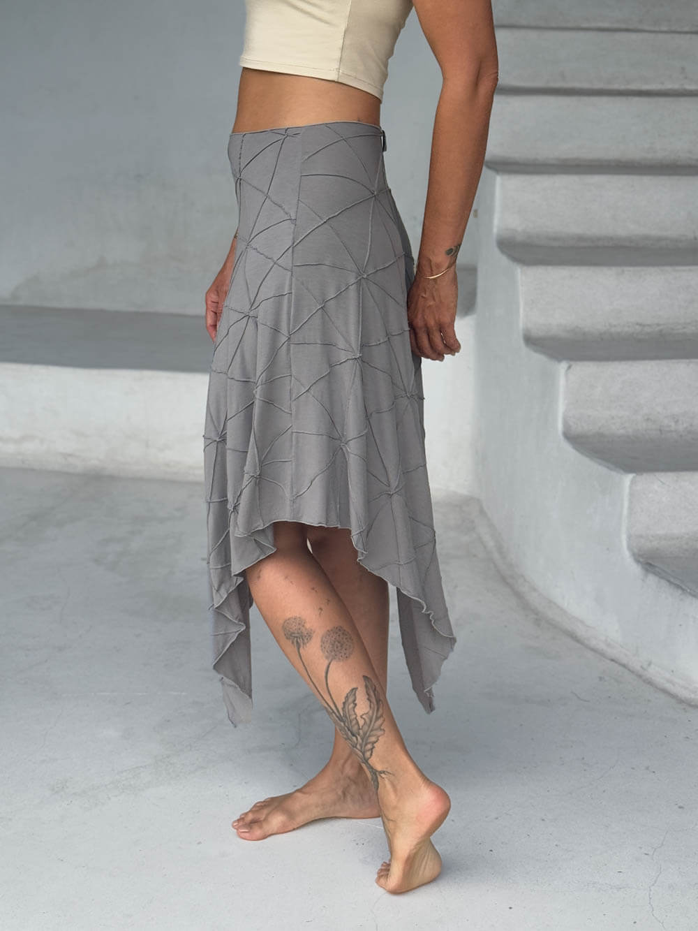 caraucci texture poncho worn as a skirt #color_stone
