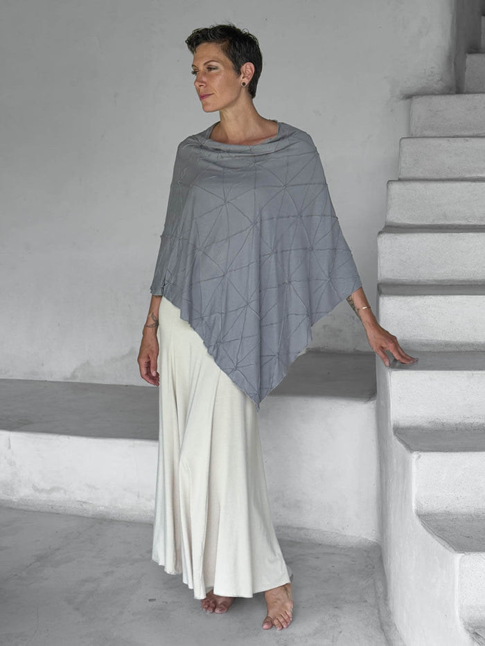 caraucci-woman-wearing-texture-poncho-in-stone-as-lightweight-layer-over-white-maxi-skirt #color_stone