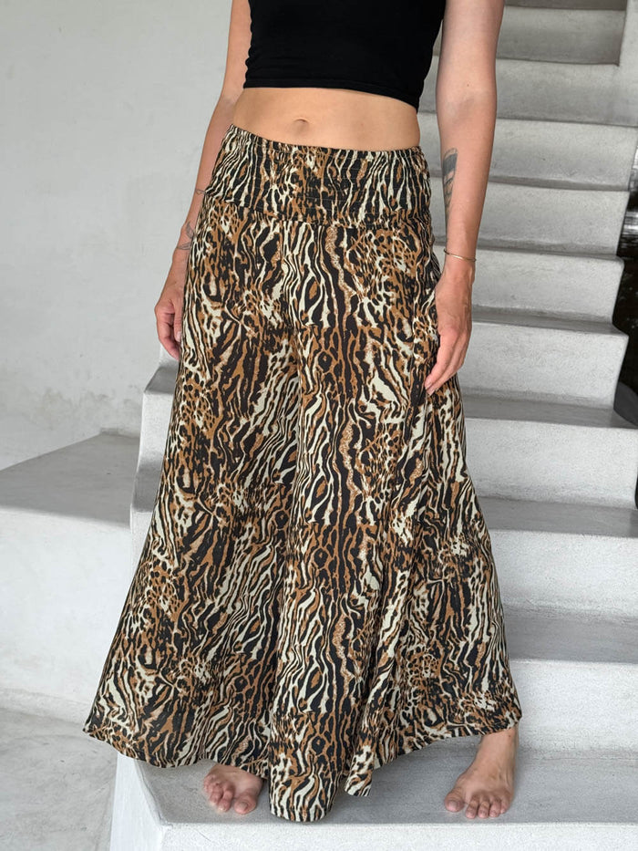 caraucci-woman-wearing-tiger-print-flow-pants-and-black-cropped-tank-top