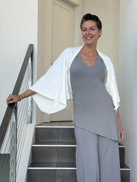 caraucci convertible white draped shrug that converts into a cowl neck backless tunic #color_off-white