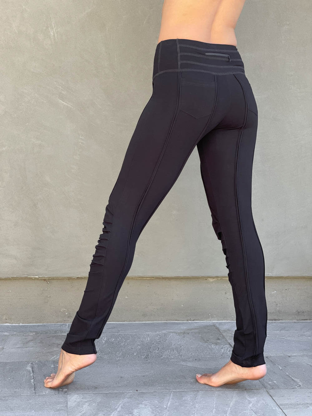 women's bamboo spandex pants with raised stitch details and 2 zipper pockets #color_black