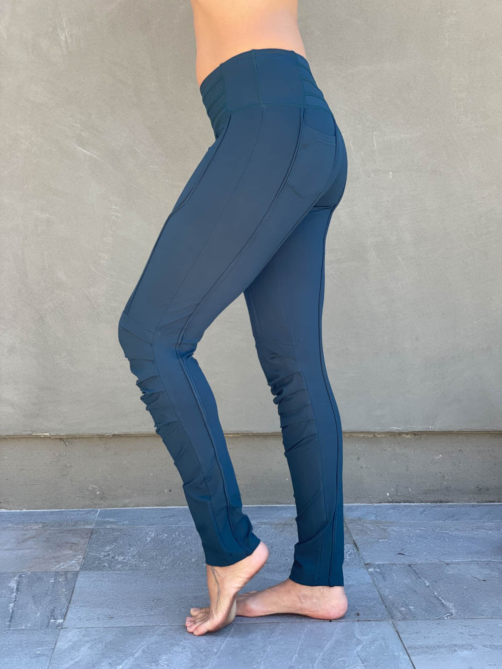 women's teal bamboo spandex pants with raised stitch details and 2 zipper pockets #color_teal