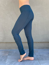 women's teal bamboo spandex pants with raised stitch details and 2 zipper pockets #color_teal