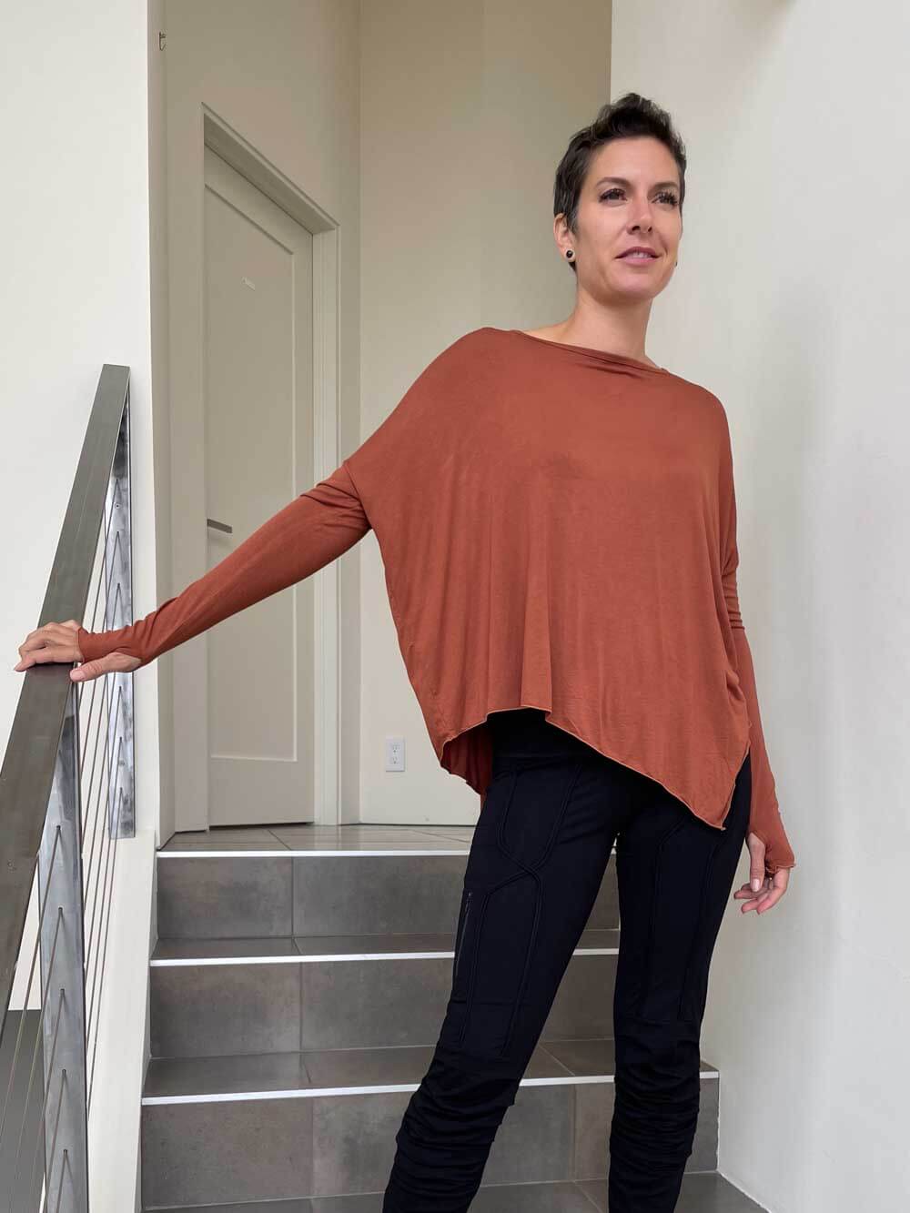 caraucci plant-based rayon jersey rust asymmetrical hem oversized long sleeve top with thumbholes #color_copper