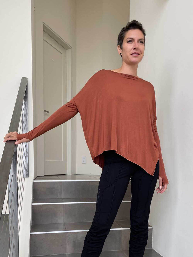 caraucci plant-based rayon jersey rust asymmetrical hem oversized long sleeve top with thumbholes #color_copper