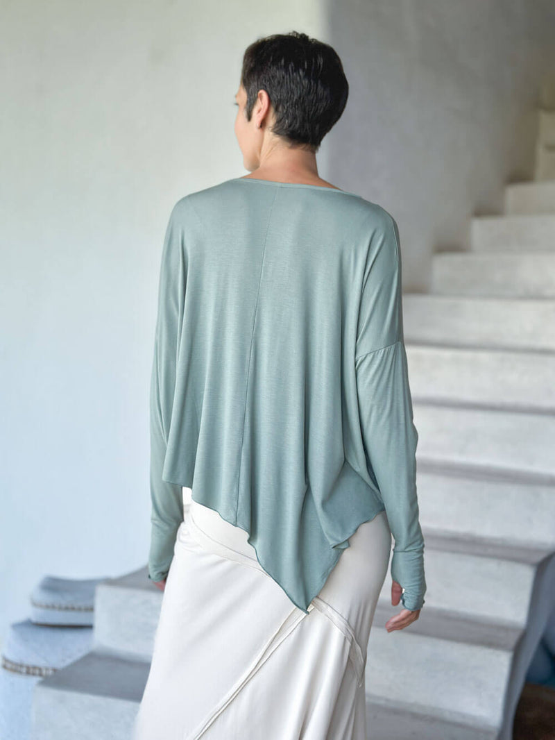 caraucci plant-based rayon jersey sage green asymmetrical hem oversized long sleeve top with thumbholes #color_moss