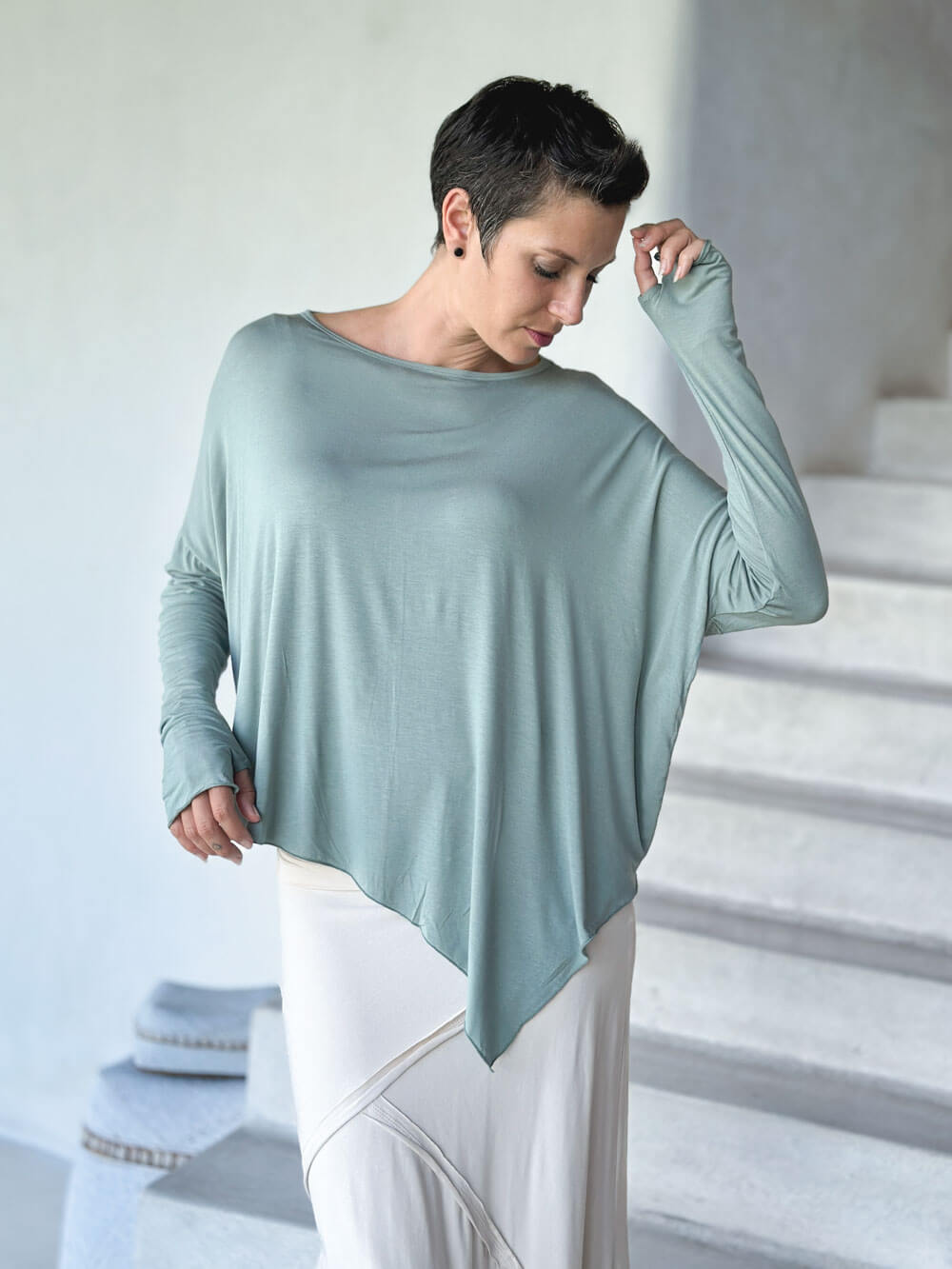 caraucci plant-based rayon jersey sage green asymmetrical hem oversized long sleeve top with thumbholes #color_moss