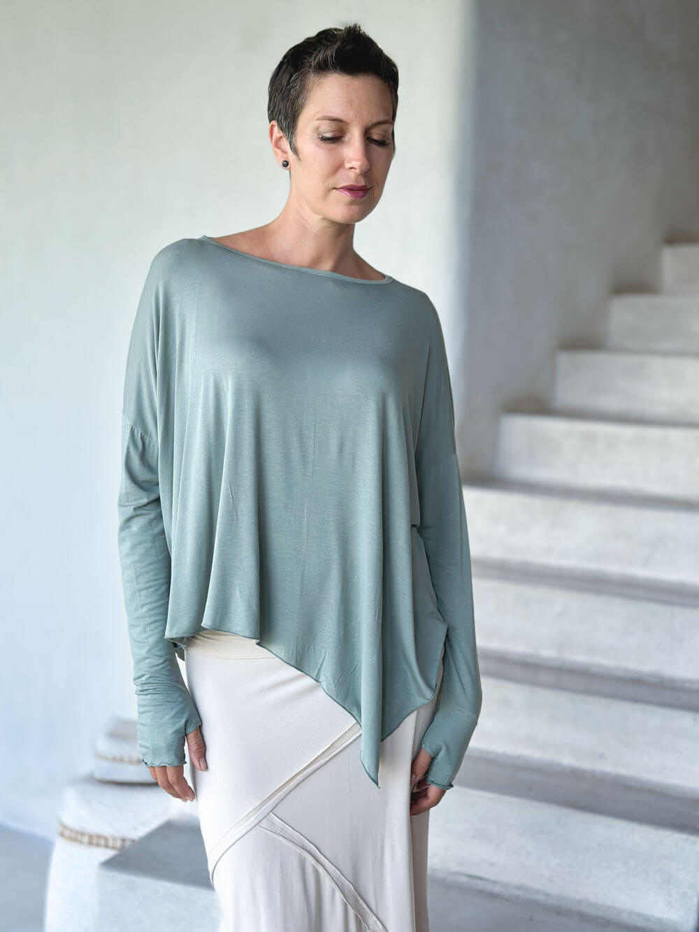 caraucci plant-based rayon jersey sage green asymmetrical hem oversized long sleeve top with thumbholes #color_moss