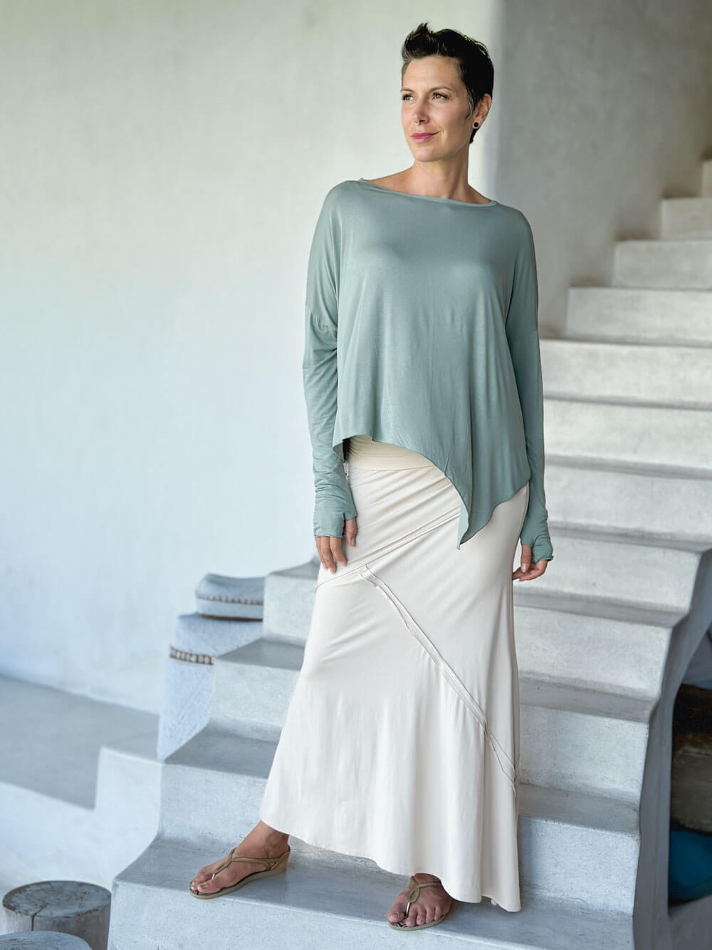 caraucci plant-based rayon jersey sage green asymmetrical hem oversized long sleeve top with thumbholes #color_moss