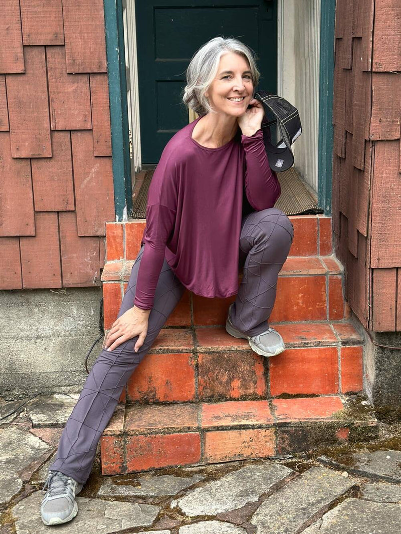 caraucci long sleeve round neck purple top with asymmetrical hemline and thumbholes #color_jam