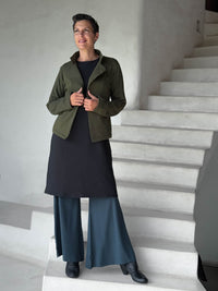 caraucci forest green bamboo fleece unstructured blazer jacket over black fleece dress and teal flare joy pants #color_forest