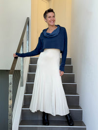 caraucci bamboo cotton fleece navy blue cropped cowl neck long sleeve shrug worn over cream hourglass maxi dress #color_navy