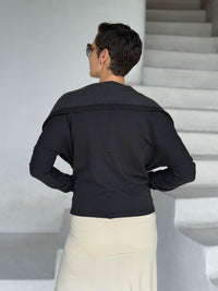 caraucci black bamboo fleece jacket, shown open from the back with a draped shawl color with thumbholes and pockets #color_black
