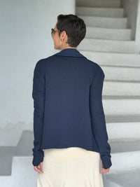 caraucci navy blue bamboo fleece jacket, shown open from the back with a draped shawl color with thumbholes and pockets #color_navy