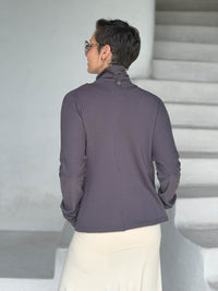caraucci steel gray bamboo fleece jacket shown buttoned into a high cowl neck with thumbholes and pockets #color_steel