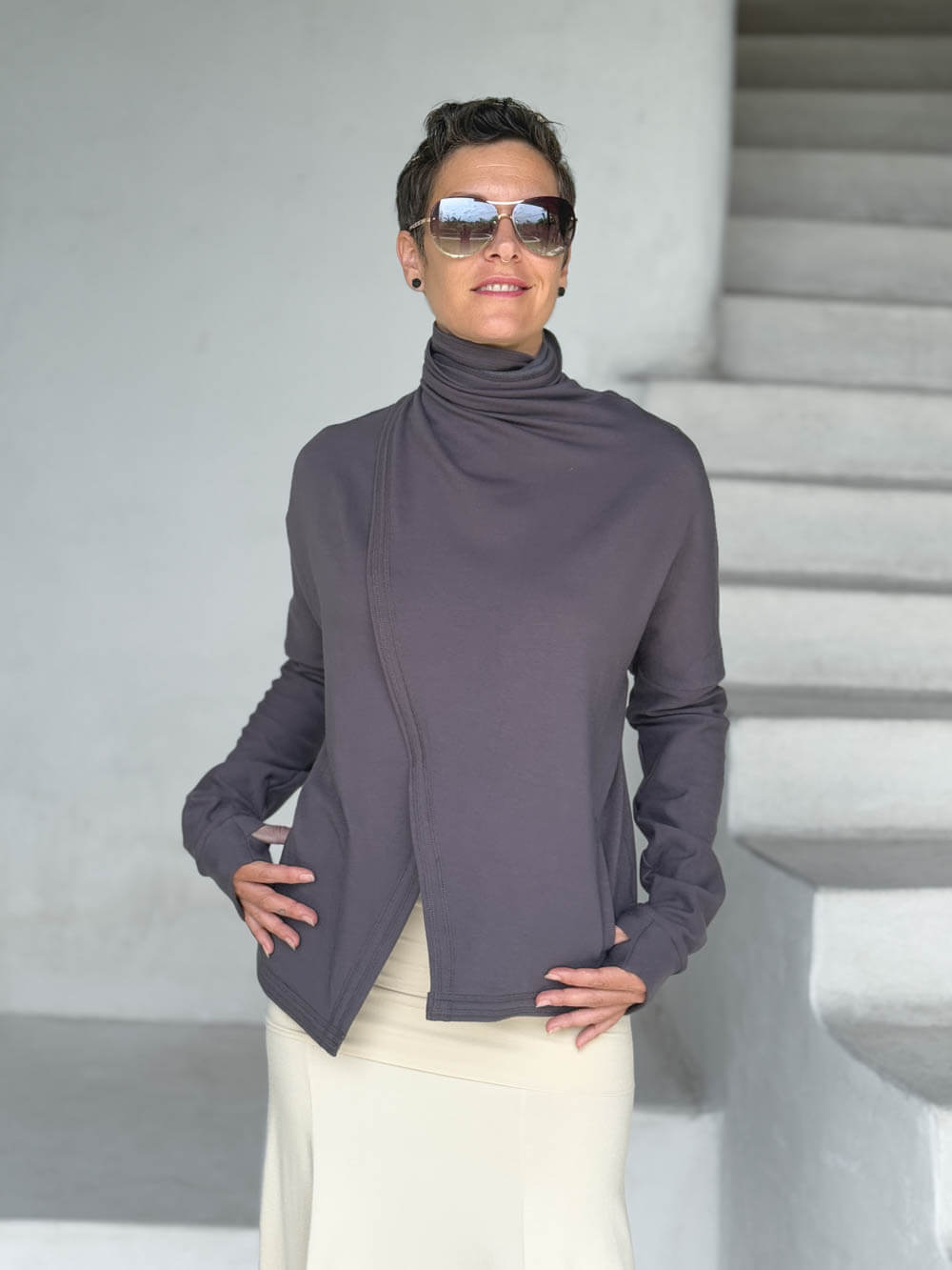 caraucci steel gray bamboo fleece jacket shown buttoned into a high cowl neck with thumbholes and pockets #color_steel