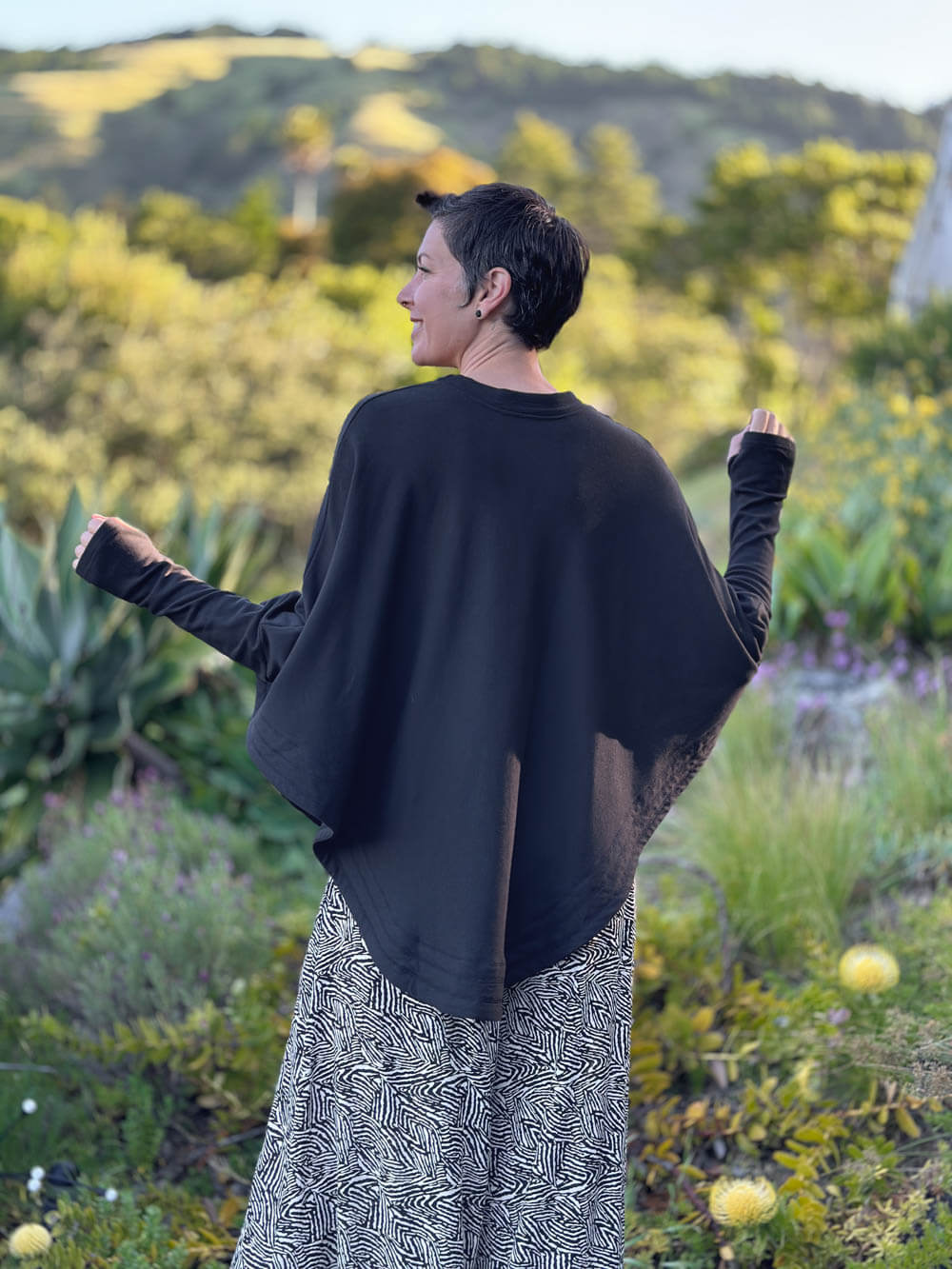 caraucci black bamboo cotton fleece oversized poncho with thumbholes #color_black