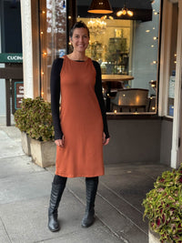 caraucci bamboo fleece orange sleeveless sweatshirt dress and tunic layered over black long sleeve boatneck top #color_copper