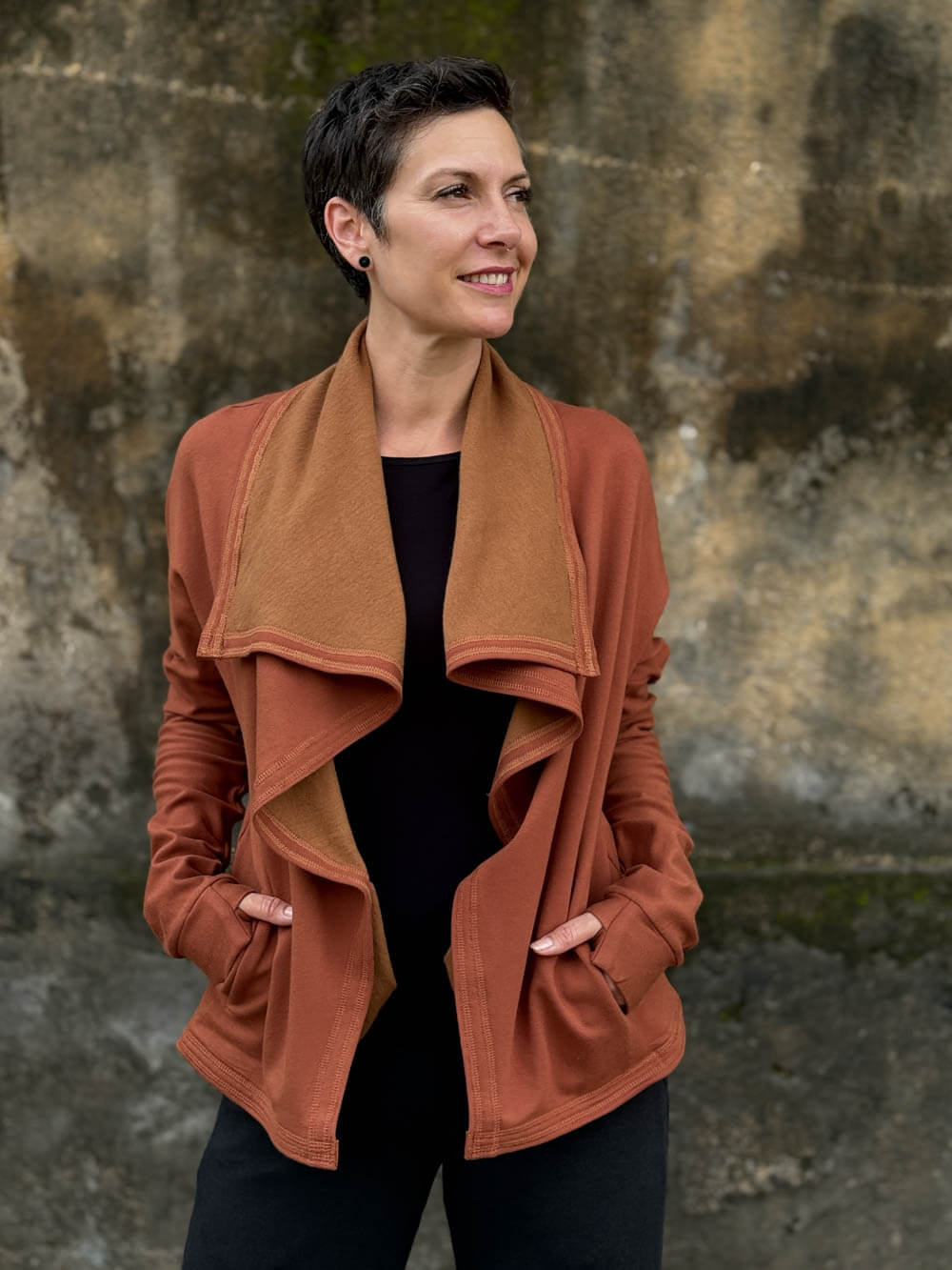 caraucci orange bamboo fleece jacket, shown open with a draped shawl color with thumbholes and pockets #color_copper