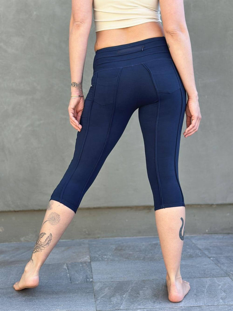 women's cotton lycra stretchy navy blue capri leggings with ruched knees and raised detail stitching #color_navy