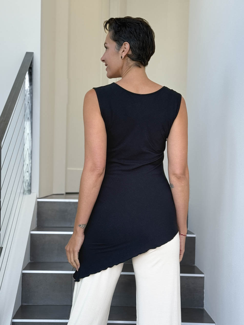 caraucci sleeveless scoop neck bias cut black asymmetrical hem tunic and white shrug #color_black