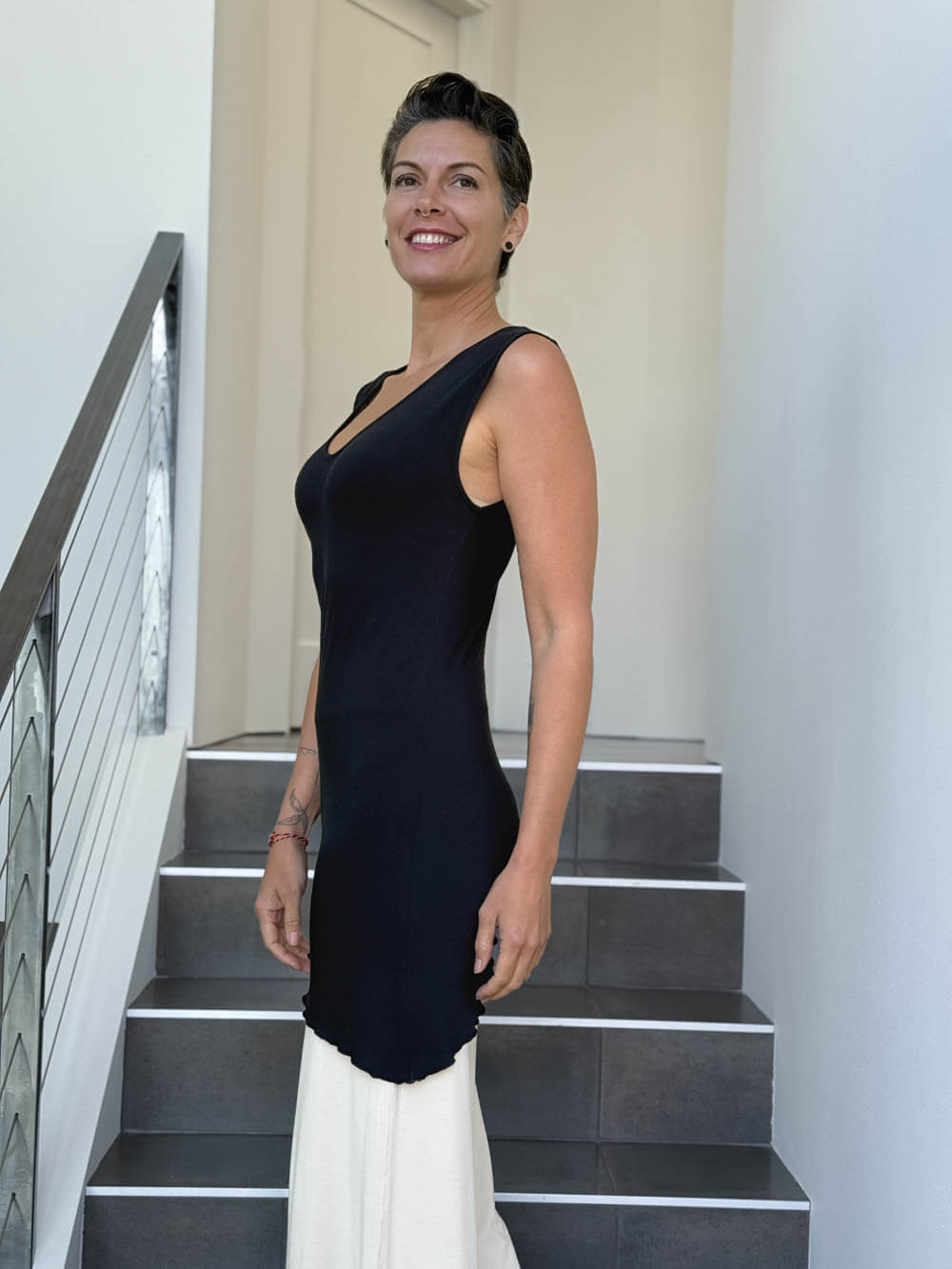 caraucci sleeveless scoop neck bias cut black asymmetrical hem tunic and white shrug #color_black