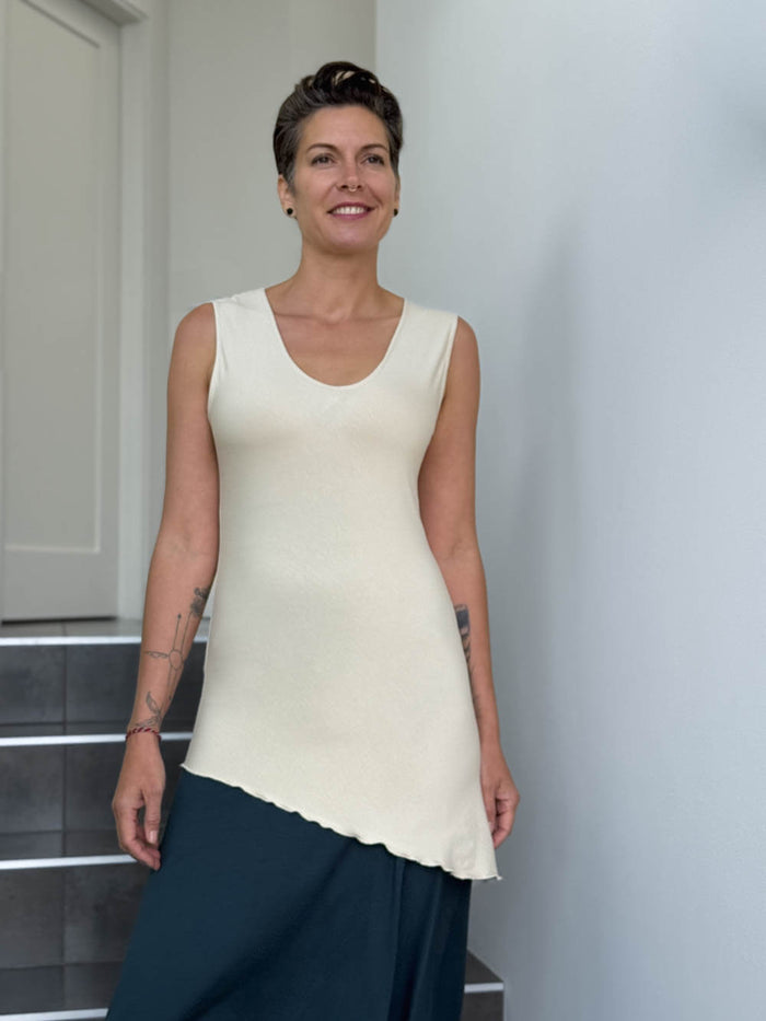 caraucci sleeveless scoop neck bias cut cream asymmetrical hem tunic #color_cream