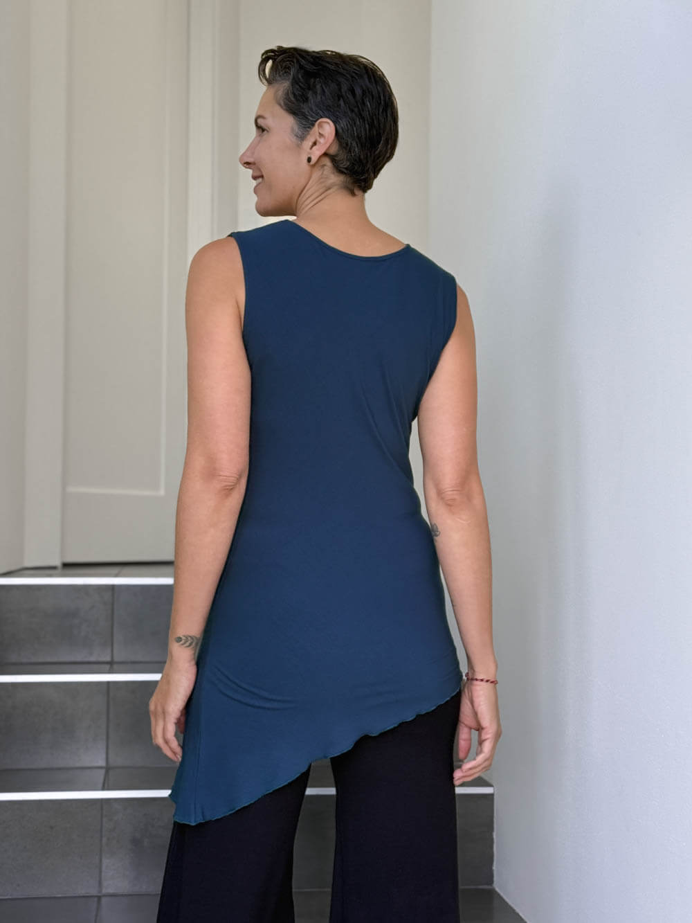caraucci sleeveless scoop neck bias cut navy blue asymmetrical hem tunic #color_navy