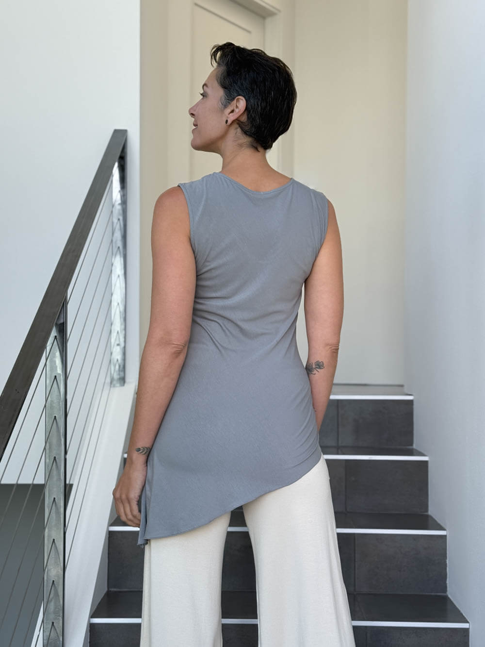 caraucci sleeveless scoop neck bias cut gray asymmetrical hem tunic and white shrug #color_stone